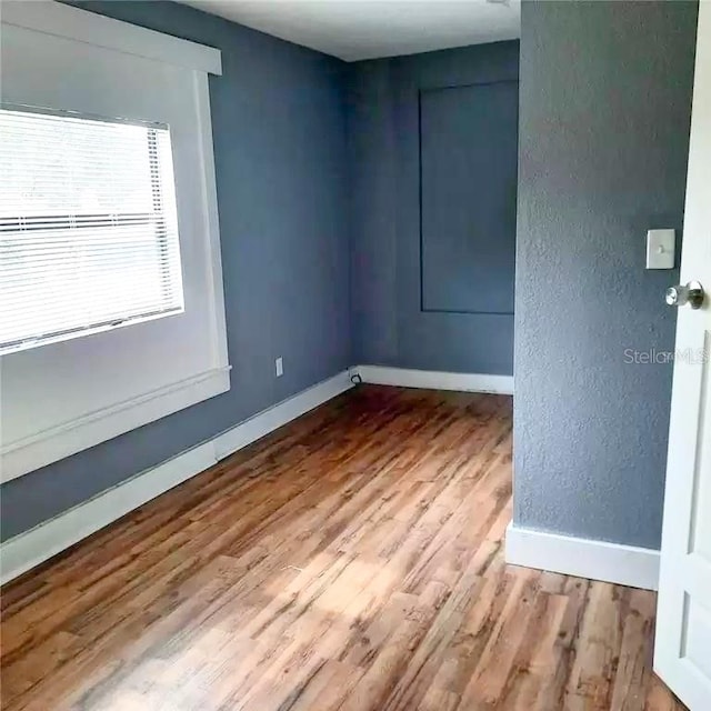 unfurnished room featuring light hardwood / wood-style flooring