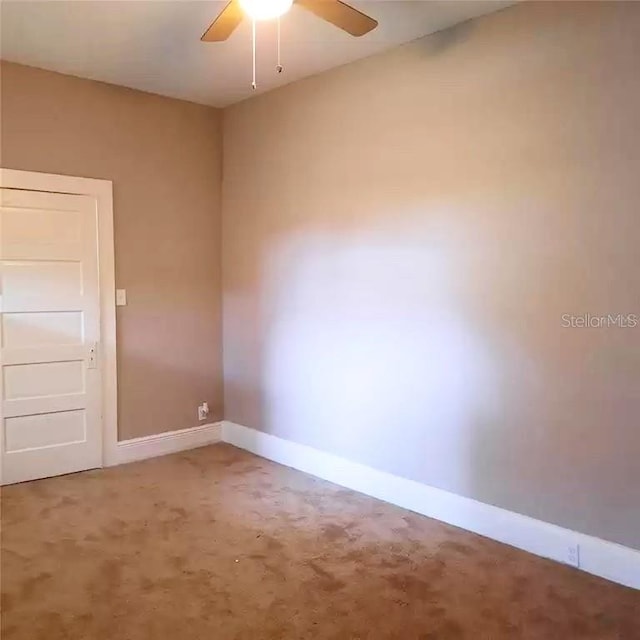 carpeted empty room with ceiling fan