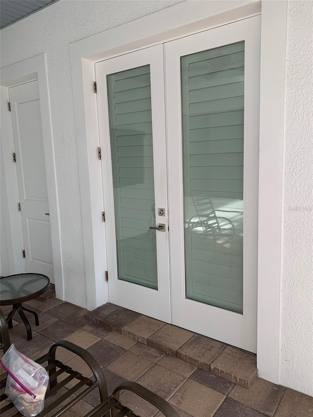 doorway to property featuring french doors