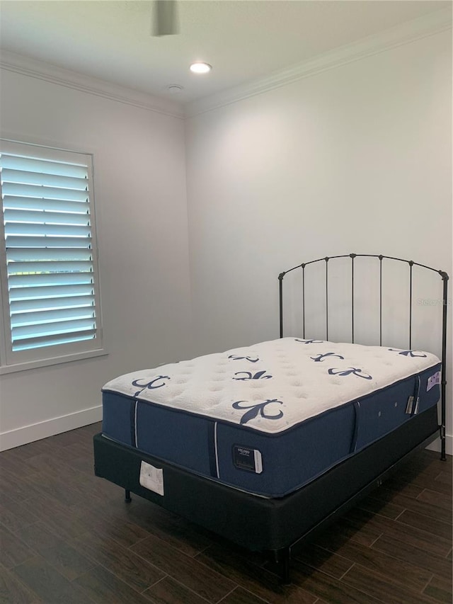 bedroom featuring dark hardwood / wood-style floors and ornamental molding