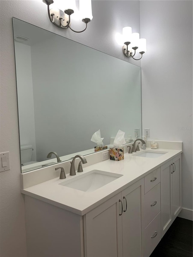 bathroom with vanity and toilet