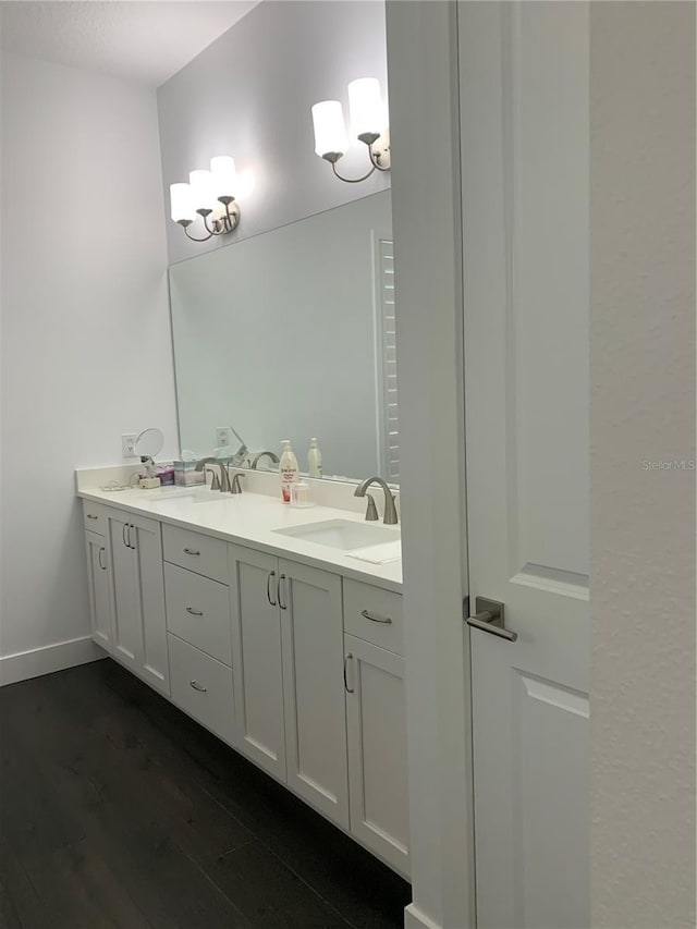 bathroom featuring hardwood / wood-style floors and vanity