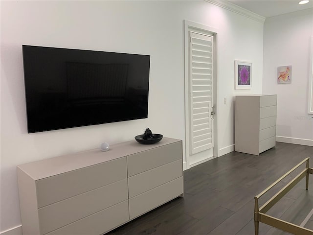 interior space featuring dark hardwood / wood-style floors and ornamental molding