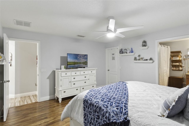 bedroom featuring ceiling fan and dark wood-type flooring