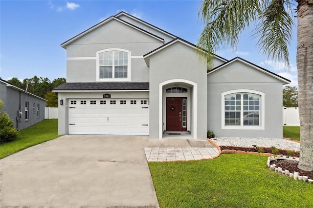 view of front facade featuring a front yard and a garage