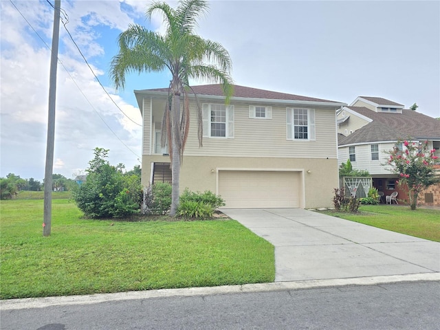 view of front of home featuring a garage and a front lawn