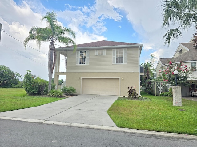 view of front of property featuring a garage and a front lawn