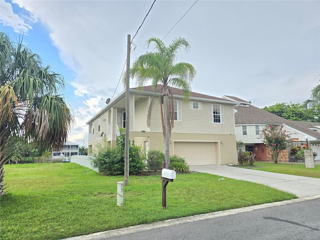 view of front of home with a garage and a front yard