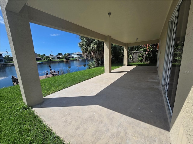 view of patio featuring a water view