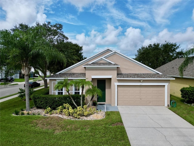 view of front facade with a garage and a front lawn