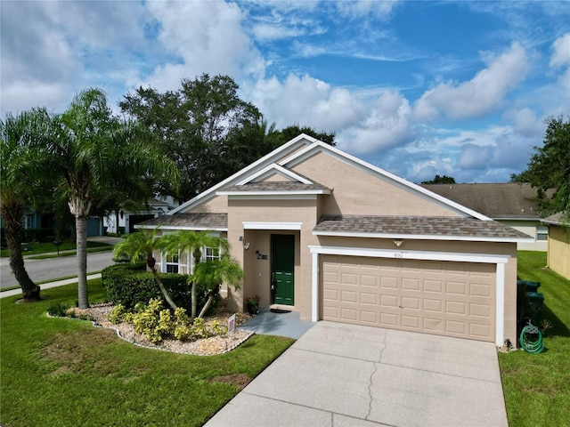 view of front facade featuring a front yard and a garage