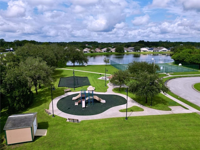 surrounding community with a lawn and a water view