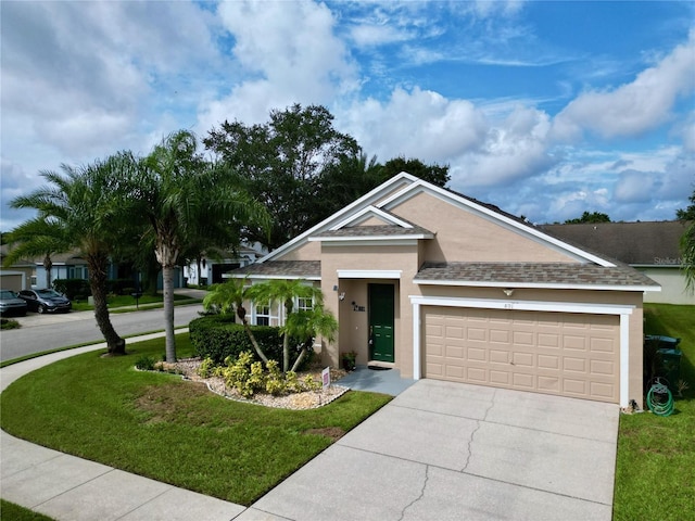 view of front facade featuring a front yard and a garage