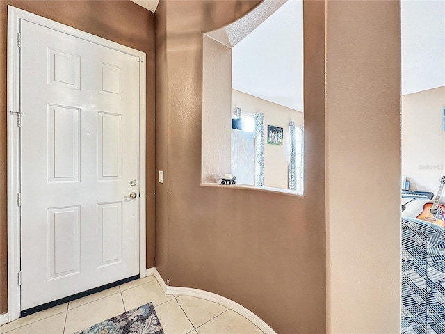 entrance foyer featuring light tile patterned floors