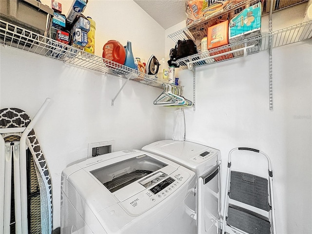 washroom with washer and dryer