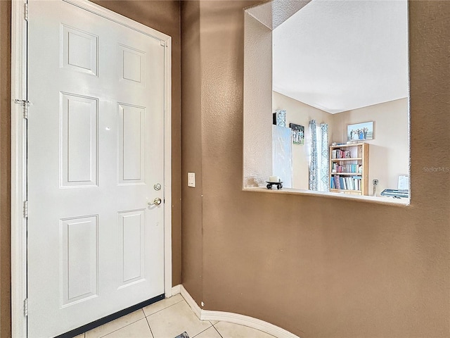 entrance foyer with light tile patterned floors