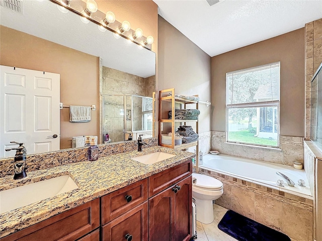 full bathroom featuring vanity, separate shower and tub, tile patterned flooring, and toilet