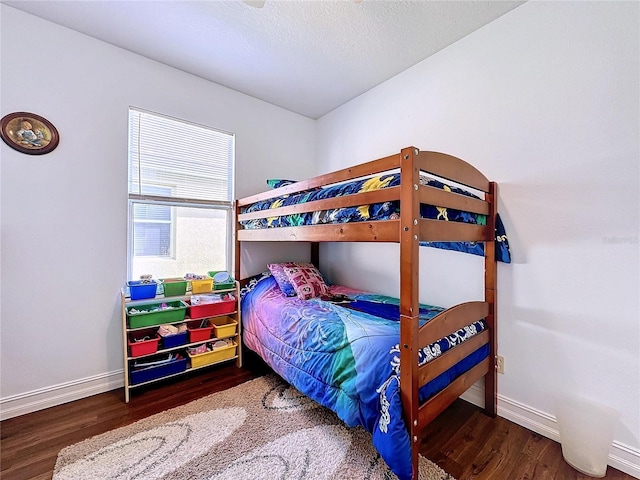 bedroom featuring dark wood-type flooring