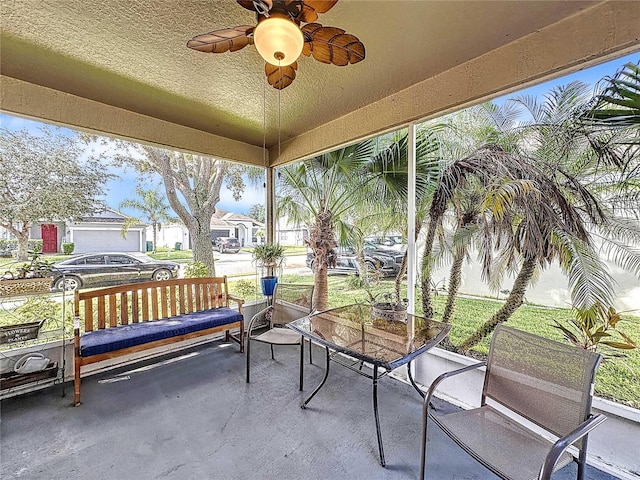 exterior space featuring ceiling fan