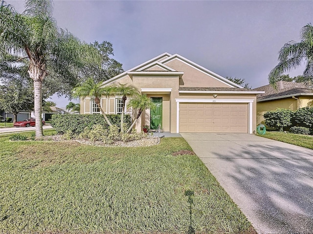 view of front of property featuring a garage and a front lawn