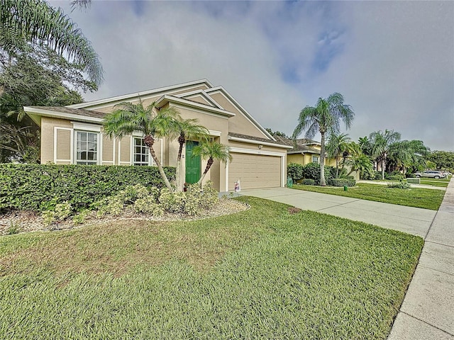 view of front of property featuring a garage and a front lawn