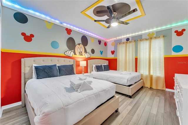 bedroom with ceiling fan and light hardwood / wood-style flooring