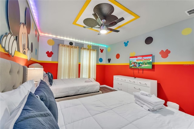 bedroom with ceiling fan and hardwood / wood-style floors