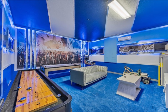 playroom featuring a textured ceiling and dark carpet