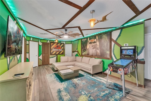 living room with wood-type flooring and ceiling fan