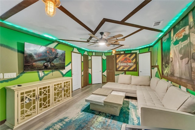 living room with wood-type flooring and ceiling fan