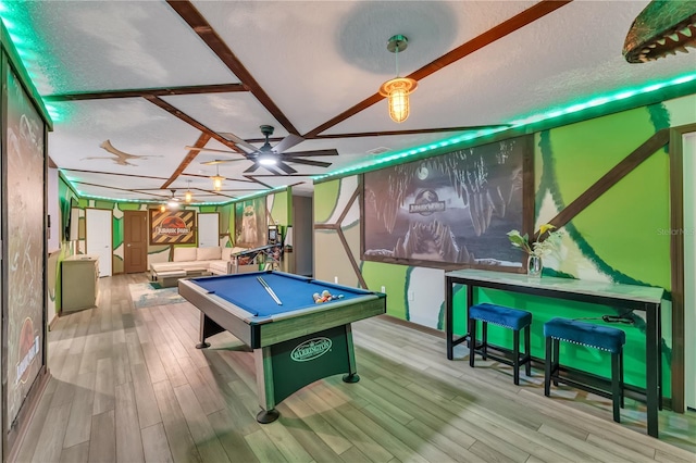 playroom featuring ceiling fan, a textured ceiling, light wood-type flooring, and pool table