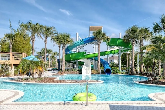 view of pool with a water slide