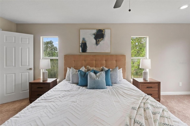 bedroom with ceiling fan and carpet