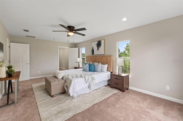 bedroom featuring ceiling fan and carpet