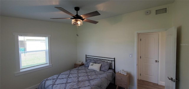 bedroom with ceiling fan and light wood-type flooring