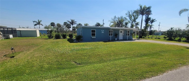 view of front of home featuring a front yard and stucco siding