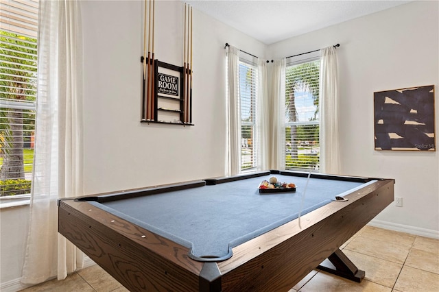 game room with pool table, plenty of natural light, and light tile patterned flooring