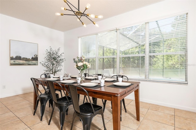 tiled dining room featuring a chandelier