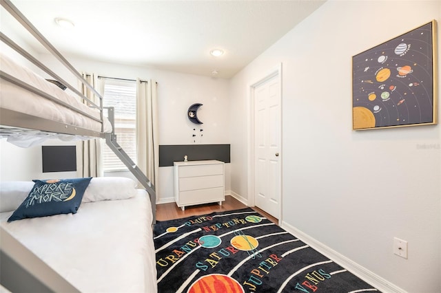 bedroom with hardwood / wood-style floors