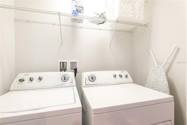 washroom with washing machine and dryer