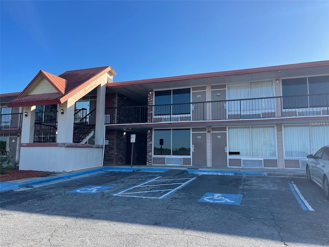 43420 Hwy 27 Unit 361, Davenport, FL 33837 - view of property featuring uncovered parking and stairs
