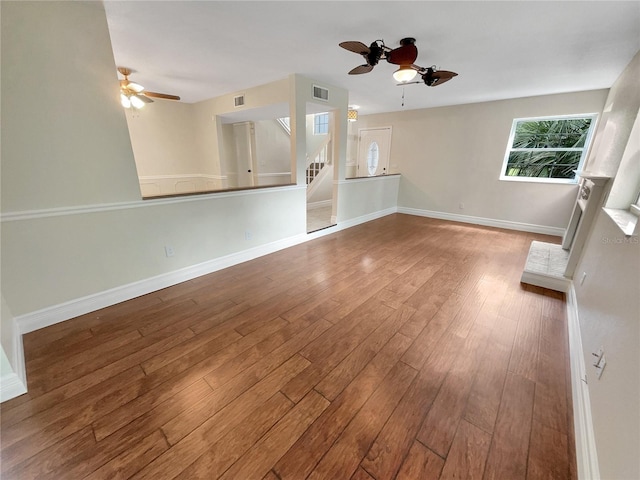 empty room featuring ceiling fan and hardwood / wood-style floors