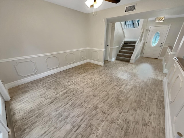 entryway featuring light hardwood / wood-style floors and ceiling fan