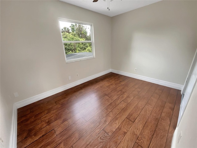 empty room with ceiling fan and hardwood / wood-style flooring