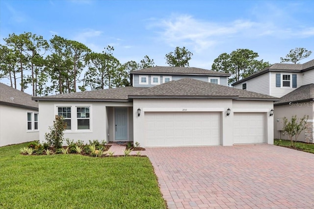 view of front of home featuring a garage and a front lawn