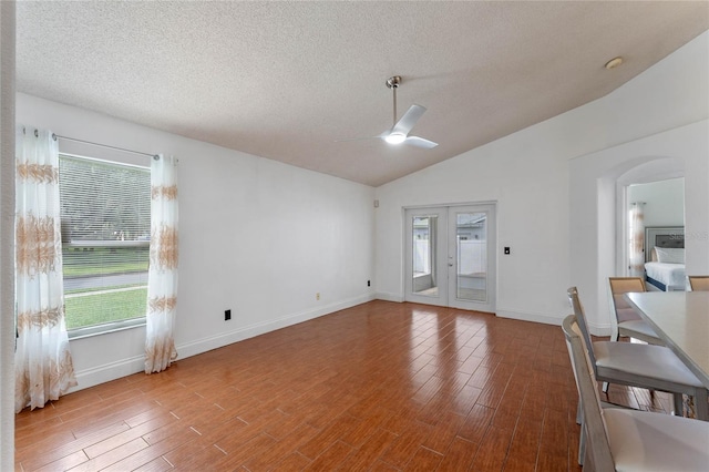 entrance foyer with ceiling fan, a healthy amount of sunlight, and lofted ceiling