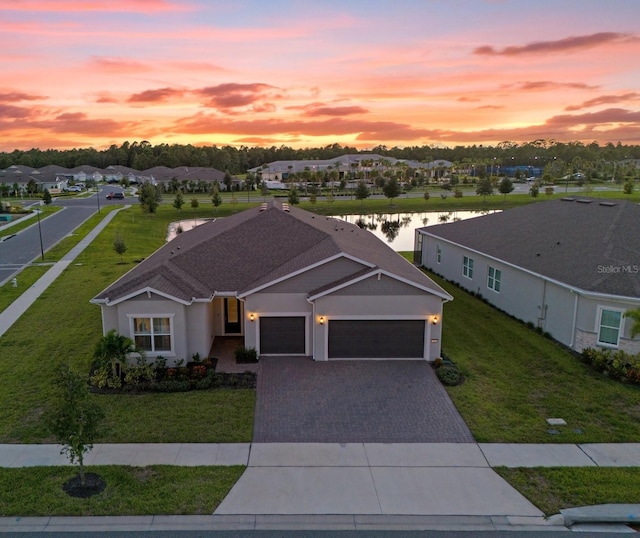 aerial view at dusk with a water view