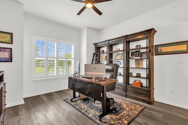 office space with ceiling fan and dark wood-type flooring