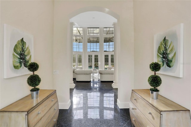 hallway with a towering ceiling