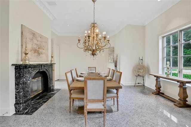 dining room featuring a notable chandelier, a fireplace, crown molding, and a wealth of natural light